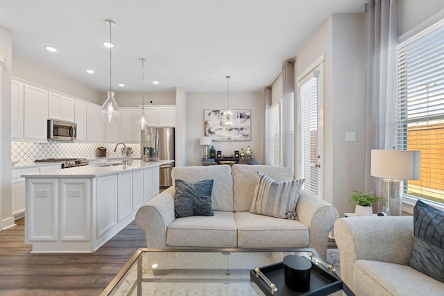 962 Ford Pines Ln, Houston, TX 77091 - living area with dark wood-style flooring and recessed lighting