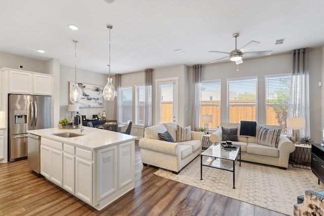 962 Ford Pines Ln, Houston, TX 77091 - kitchen with a sink, open floor plan, stainless steel appliances, a ceiling fan, and recessed lighting