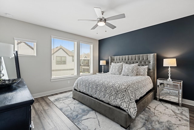 962 Ford Pines Ln, Houston, TX 77091 - bedroom featuring multiple windows, baseboards, and wood finished floors