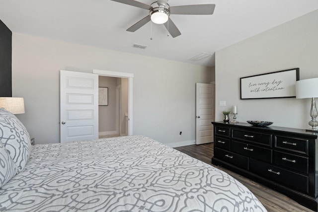 962 Ford Pines Ln, Houston, TX 77091 - bedroom with dark wood-style flooring, baseboards, and a ceiling fan