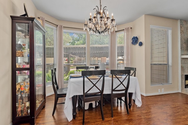 1881 Bering Dr Unit 25, Houston, TX 77057 - dining room featuring a chandelier, wood finished floors, and baseboards