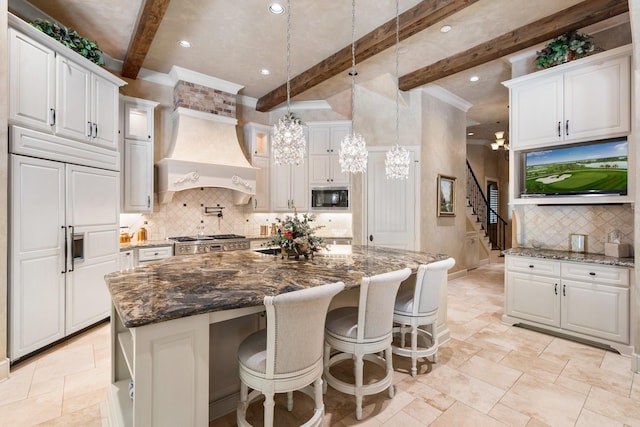 10 Maroon Creek Ct, Spring, TX 77389 - kitchen with built in appliances, beamed ceiling, custom exhaust hood, white cabinetry, and backsplash