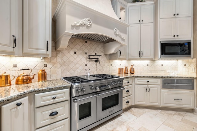 10 Maroon Creek Ct, Spring, TX 77389 - kitchen with double oven range, a warming drawer, black microwave, premium range hood, and white cabinets