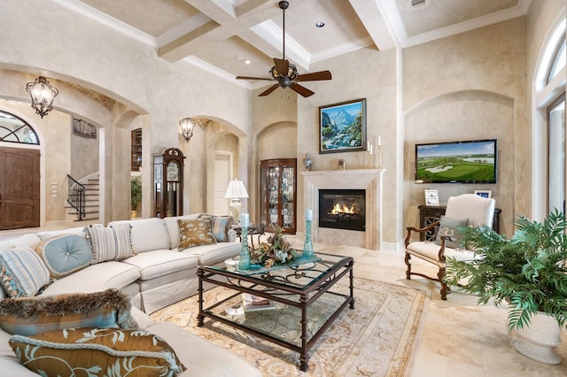 10 Maroon Creek Ct, Spring, TX 77389 - living room featuring arched walkways, beam ceiling, coffered ceiling, stairs, and a high end fireplace