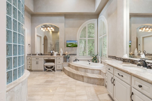 10 Maroon Creek Ct, Spring, TX 77389 - full bath featuring a bath, two vanities, and walk in shower