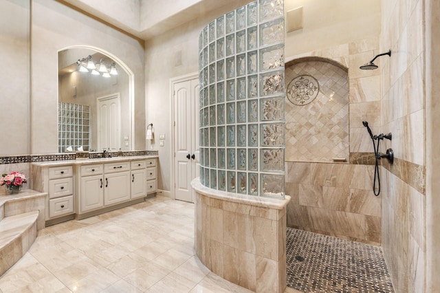 10 Maroon Creek Ct, Spring, TX 77389 - bathroom featuring a walk in shower and vanity