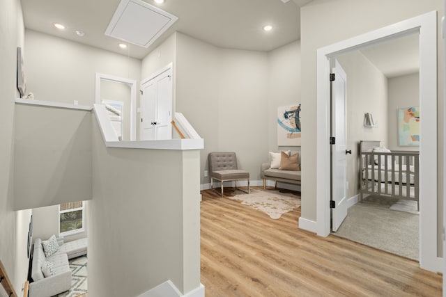 5809 Francis Oak Pl, Houston, TX 77091 - hall featuring attic access, wood finished floors, baseboards, an upstairs landing, and recessed lighting