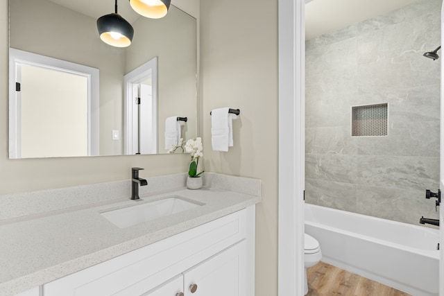 5809 Francis Oak Pl, Houston, TX 77091 - full bath featuring vanity, wood finished floors, toilet, and washtub / shower combination