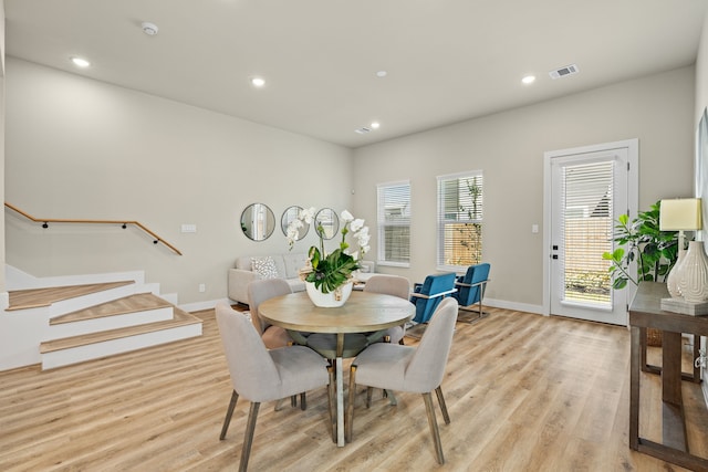 5809 Francis Oak Pl, Houston, TX 77091 - dining area with light wood finished floors, recessed lighting, stairway, and baseboards