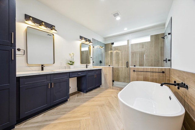 507 Leverkuhn St, Houston, TX 77007 - full bath with a stall shower, double vanity, a freestanding bath, and recessed lighting