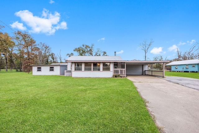 3840 N Fm 356, Onalaska, TX 77360 - ranch-style house featuring driveway, an attached carport, a front yard, and metal roof