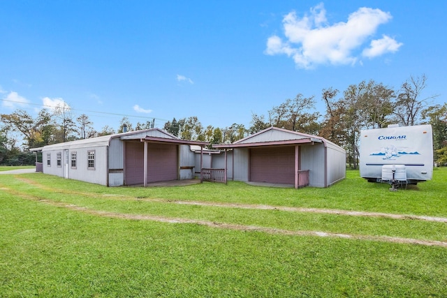 3840 N Fm 356, Onalaska, TX 77360 - view of green lawn with a detached garage