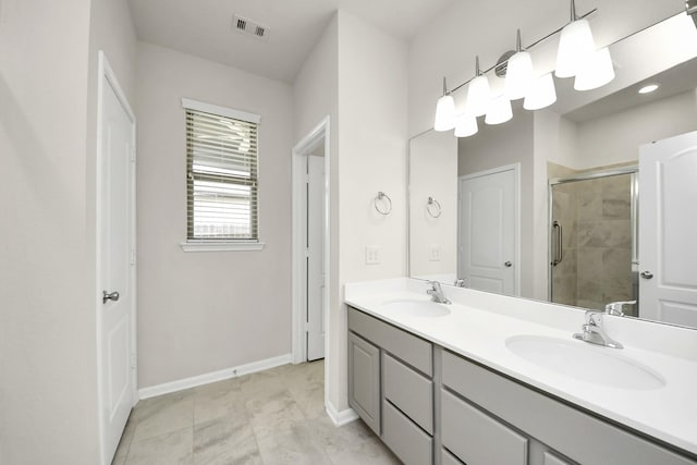 13003 Mills Creek Meadow Dr, Houston, TX 77070 - bathroom with double vanity, a shower stall, and baseboards