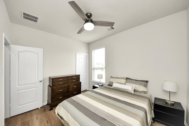 13003 Mills Creek Meadow Dr, Houston, TX 77070 - bedroom with wood finished floors and ceiling fan