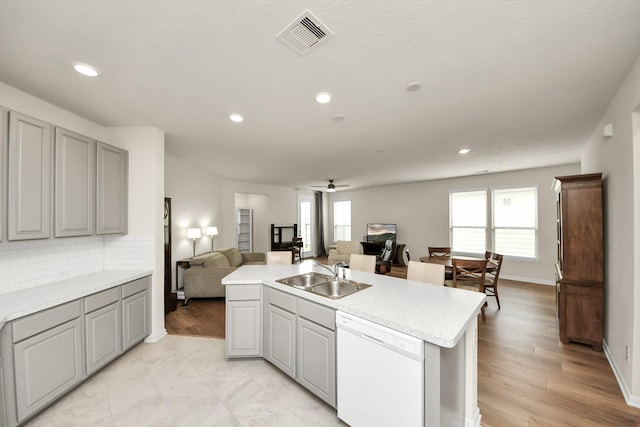 13003 Mills Creek Meadow Dr, Houston, TX 77070 - kitchen with dishwasher, a sink, open floor plan, gray cabinets, and a ceiling fan