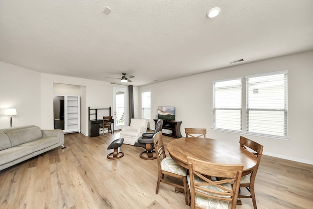 13003 Mills Creek Meadow Dr, Houston, TX 77070 - dining area with ceiling fan, light wood finished floors, and baseboards