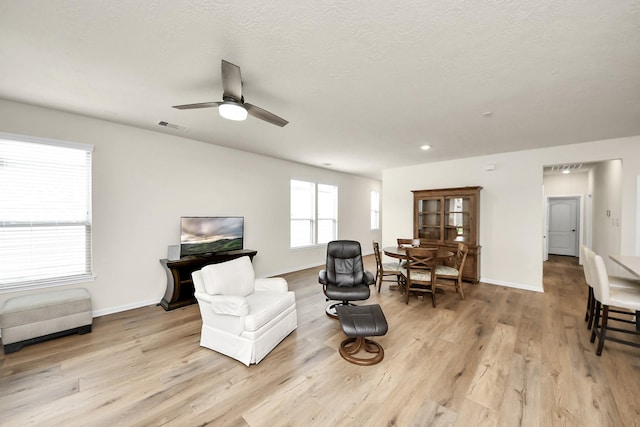13003 Mills Creek Meadow Dr, Houston, TX 77070 - sitting room featuring light wood finished floors, a ceiling fan, and baseboards