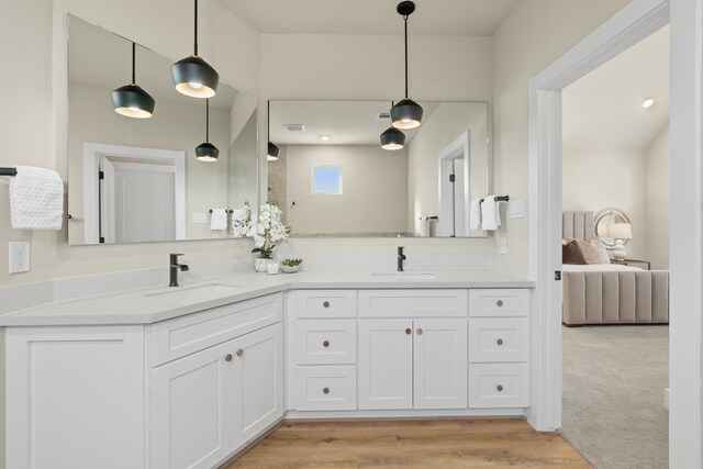 5811 Francis Oak Pl, Houston, TX 77091 - bathroom featuring double vanity and wood finished floors