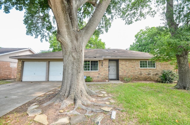 5914 Newquay St, Houston, TX 77085 - ranch-style home with concrete driveway, a garage, brick siding, a front lawn, and a shingled roof