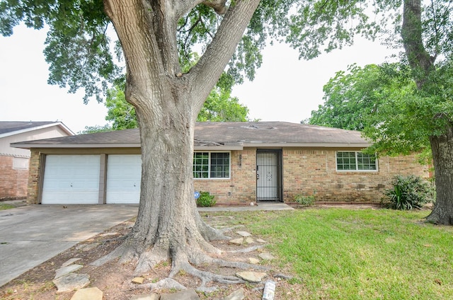 5914 Newquay St, Houston, TX 77085 - ranch-style house featuring driveway, a garage, brick siding, a front yard, and a shingled roof