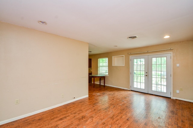 5914 Newquay St, Houston, TX 77085 - unfurnished room with baseboards, french doors, wood finished floors, and recessed lighting