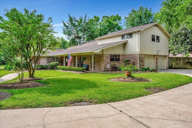 1705 E Texas Ave, Baytown, TX 77520 - view of front facade featuring brick siding, driveway, and a garage