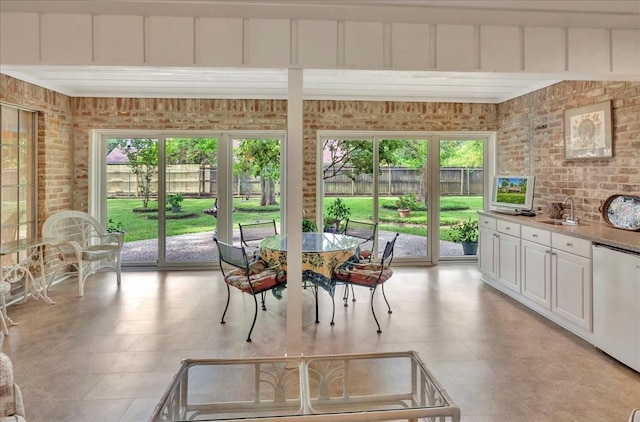 1705 E Texas Ave, Baytown, TX 77520 - dining room featuring brick wall