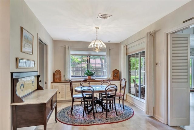 1705 E Texas Ave, Baytown, TX 77520 - dining area featuring a chandelier and baseboards
