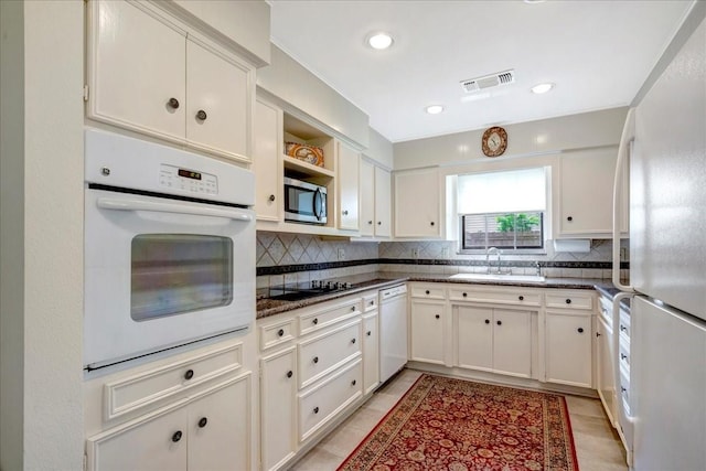 1705 E Texas Ave, Baytown, TX 77520 - kitchen featuring white appliances, a sink, decorative backsplash, open shelves, and recessed lighting