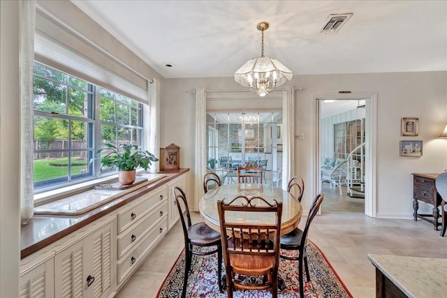 1705 E Texas Ave, Baytown, TX 77520 - dining area featuring a chandelier and baseboards