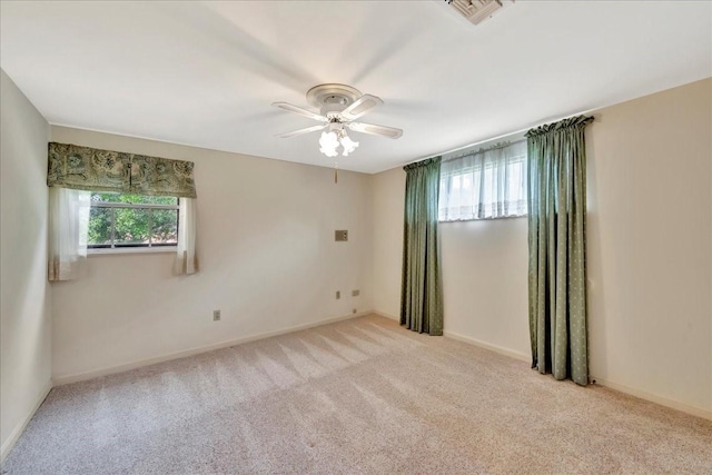 1705 E Texas Ave, Baytown, TX 77520 - spare room featuring a ceiling fan, carpet flooring, and baseboards