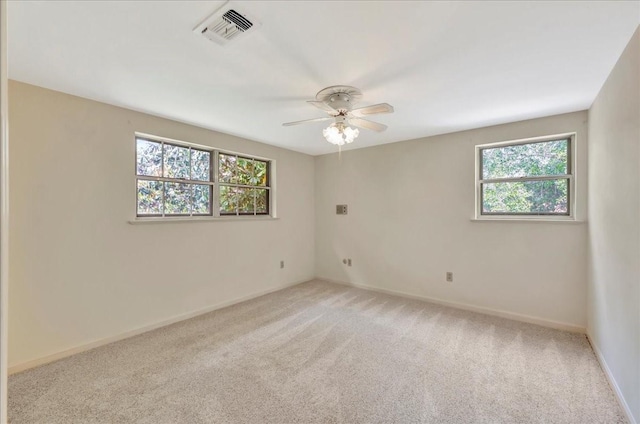 1705 E Texas Ave, Baytown, TX 77520 - unfurnished room featuring carpet floors, ceiling fan, and baseboards