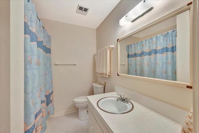 1705 E Texas Ave, Baytown, TX 77520 - bathroom with vanity, toilet, tile patterned flooring, baseboards, and a shower with shower curtain