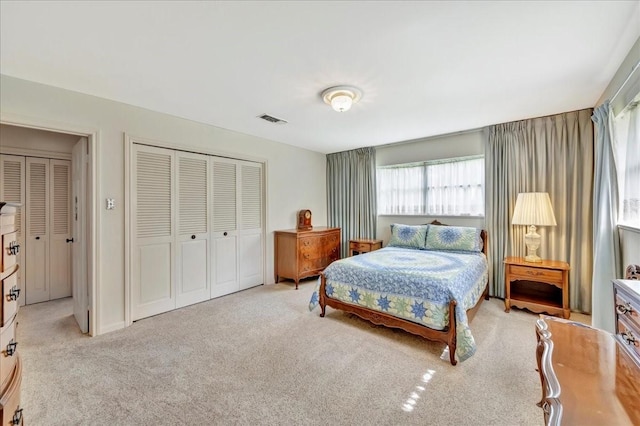 1705 E Texas Ave, Baytown, TX 77520 - bedroom with a closet and light carpet