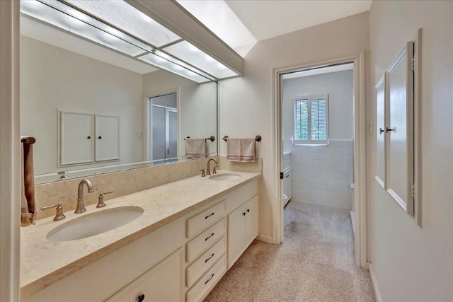1705 E Texas Ave, Baytown, TX 77520 - full bath featuring toilet, double vanity, and an enclosed shower