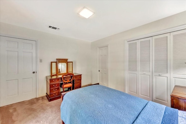 1705 E Texas Ave, Baytown, TX 77520 - bedroom with light colored carpet and a closet