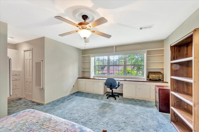 1705 E Texas Ave, Baytown, TX 77520 - home office with light carpet, ceiling fan, and baseboards