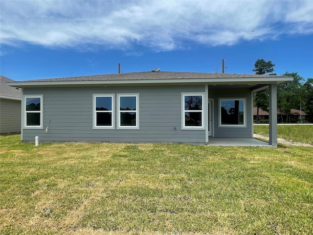 8 Greenway Dr, Trinity, TX 75862 - rear view of house featuring a patio area and a lawn