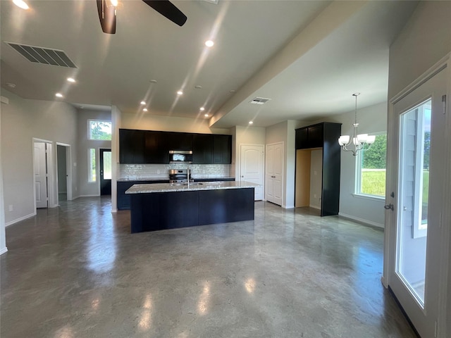 8 Greenway Dr, Trinity, TX 75862 - kitchen featuring baseboards, concrete floors, stainless steel appliances, a ceiling fan, and an island with sink