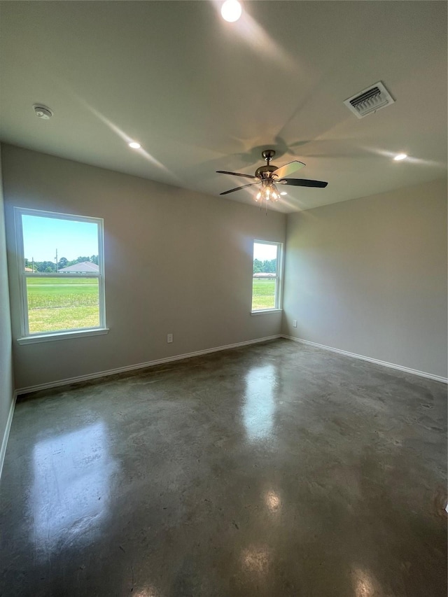 8 Greenway Dr, Trinity, TX 75862 - empty room with finished concrete flooring, baseboards, ceiling fan, a smoke detector, and recessed lighting