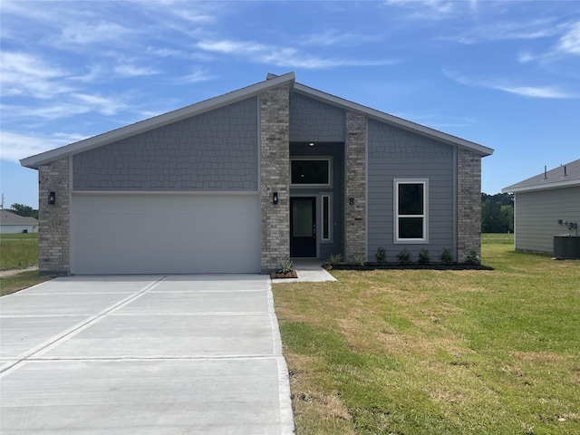 8 Greenway Dr, Trinity, TX 75862 - view of front of property with concrete driveway, central AC unit, a front lawn, and a garage