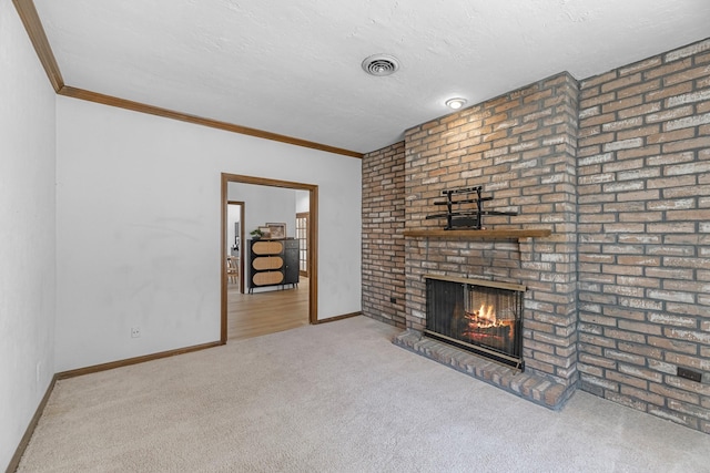 1915 Morton League Rd, Richmond, TX 77406 - unfurnished living room featuring carpet, a brick fireplace, baseboards, crown molding, and a textured ceiling