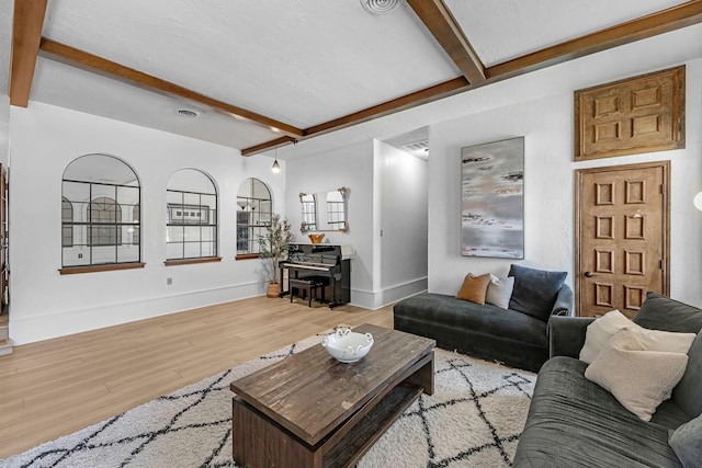 1915 Morton League Rd, Richmond, TX 77406 - living area with beam ceiling, wood finished floors, and baseboards