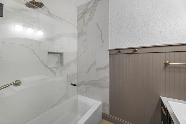 1915 Morton League Rd, Richmond, TX 77406 - full bathroom featuring wainscoting, vanity, and shower / tub combination