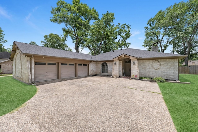 1915 Morton League Rd, Richmond, TX 77406 - ranch-style house featuring brick siding, an attached garage, concrete driveway, a chimney, and roof with shingles