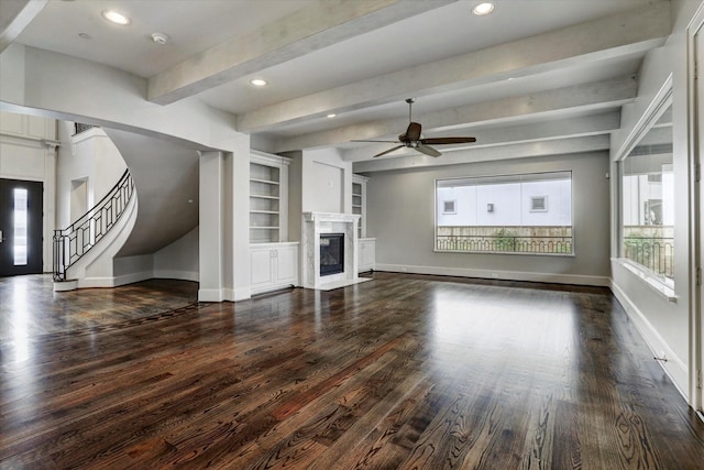 8304 Maple Ct, Bellaire, TX 77401 - unfurnished living room featuring ceiling fan, baseboards, beam ceiling, dark wood-style flooring, and a premium fireplace