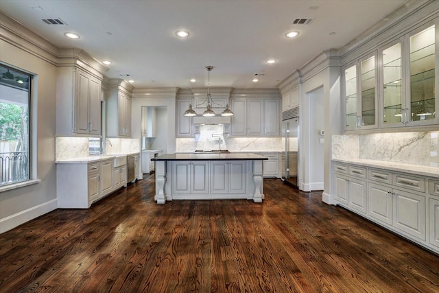 8304 Maple Ct, Bellaire, TX 77401 - kitchen featuring decorative backsplash, appliances with stainless steel finishes, dark wood-type flooring, and recessed lighting
