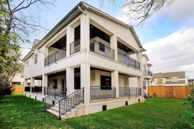 8304 Maple Ct, Bellaire, TX 77401 - back of house with stucco siding and a balcony