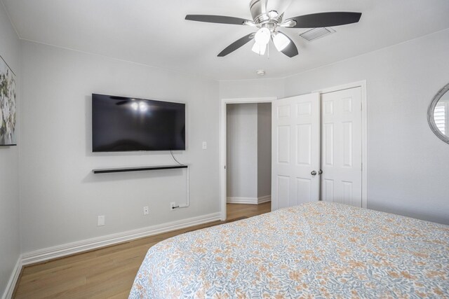 1441 W 25th St Unit D, Houston, TX 77008 - bedroom featuring wood finished floors, baseboards, and a ceiling fan
