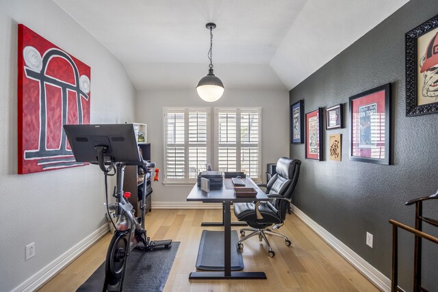 1441 W 25th St Unit D, Houston, TX 77008 - office area featuring wood finished floors, vaulted ceiling, a textured wall, and baseboards